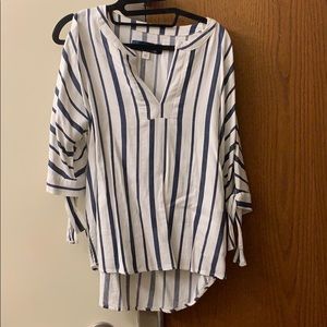 Quarter sleeve shirt with slits in sleeves
